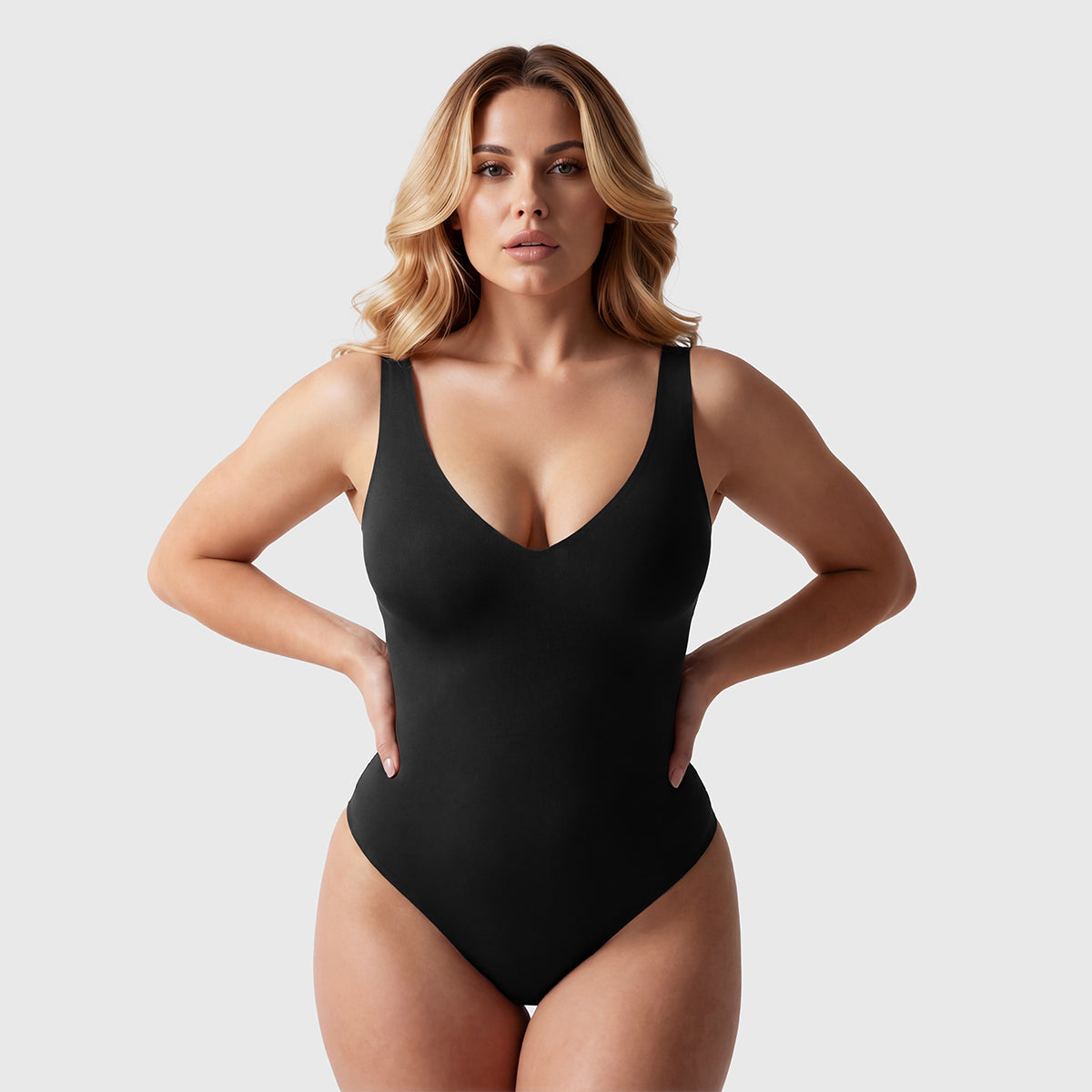 Shevee unlined plunge thong Bodysuit black back stretch pose thong silhouette
